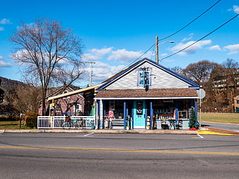 Charming Blue and White Coffee Shop on Sunny Day