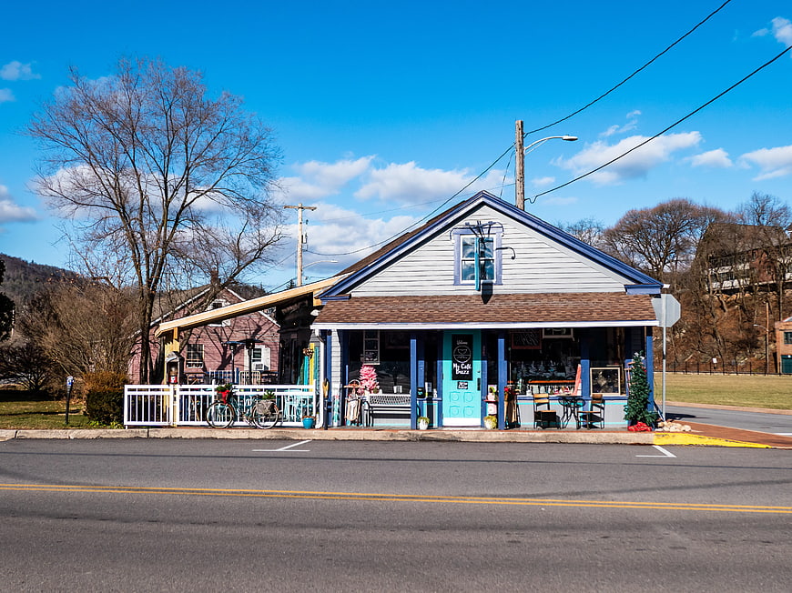Charming Blue and White Coffee Shop on Sunny Day