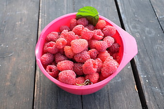 Fresh Raspberries in Pink Bowl on Wooden Table
