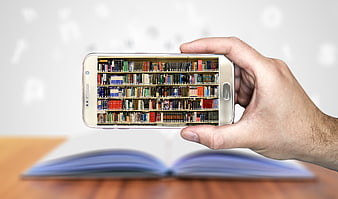 Hand holding smartphone with digital library bookshelf screen