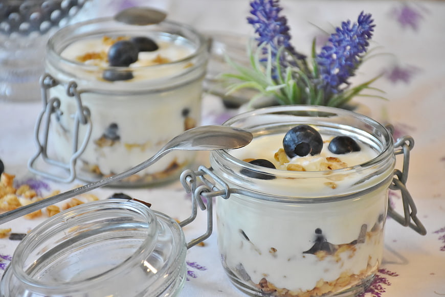 Yogurt Parfait with Blueberries and Granola in Glass Jars