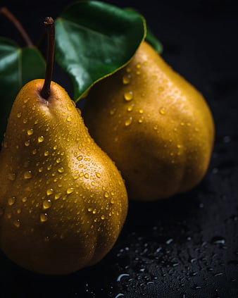 Fresh Golden Pears with Water Drops on Dark Background