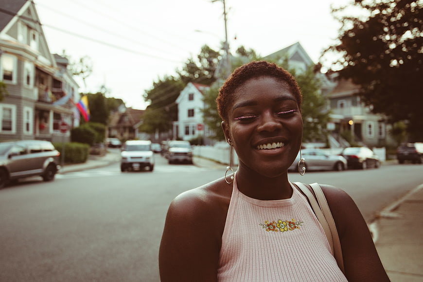 Smiling Black Woman with Short Hair on Urban Street