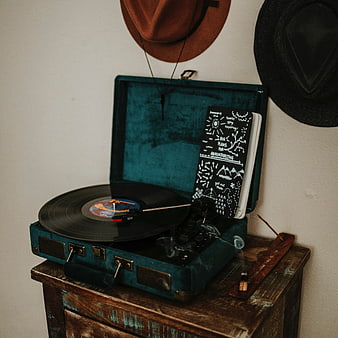 Vintage teal suitcase turntable with vinyl record and smoke