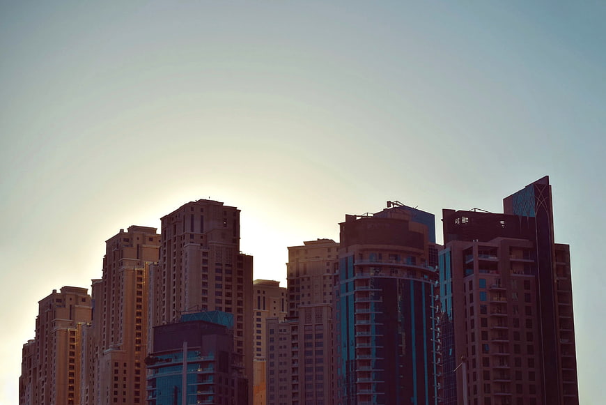 Modern City Skyline at Sunset with High-Rise Buildings