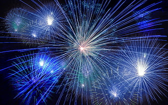 Vibrant Blue Fireworks Exploding in Night Sky