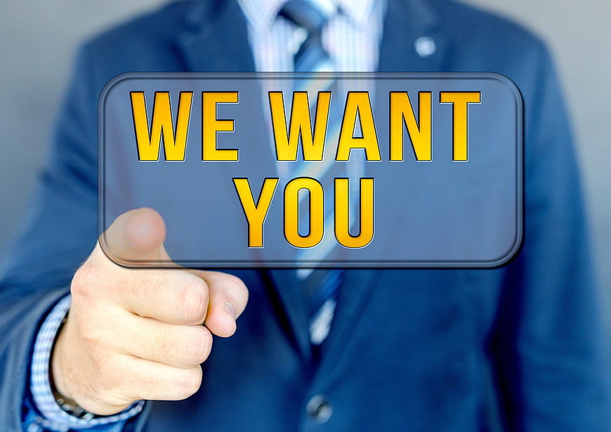 Businessman Pressing We Want You Button On Digital Interface