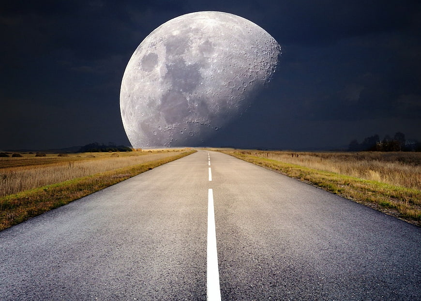 Giant Moon Over Straight Road at Night