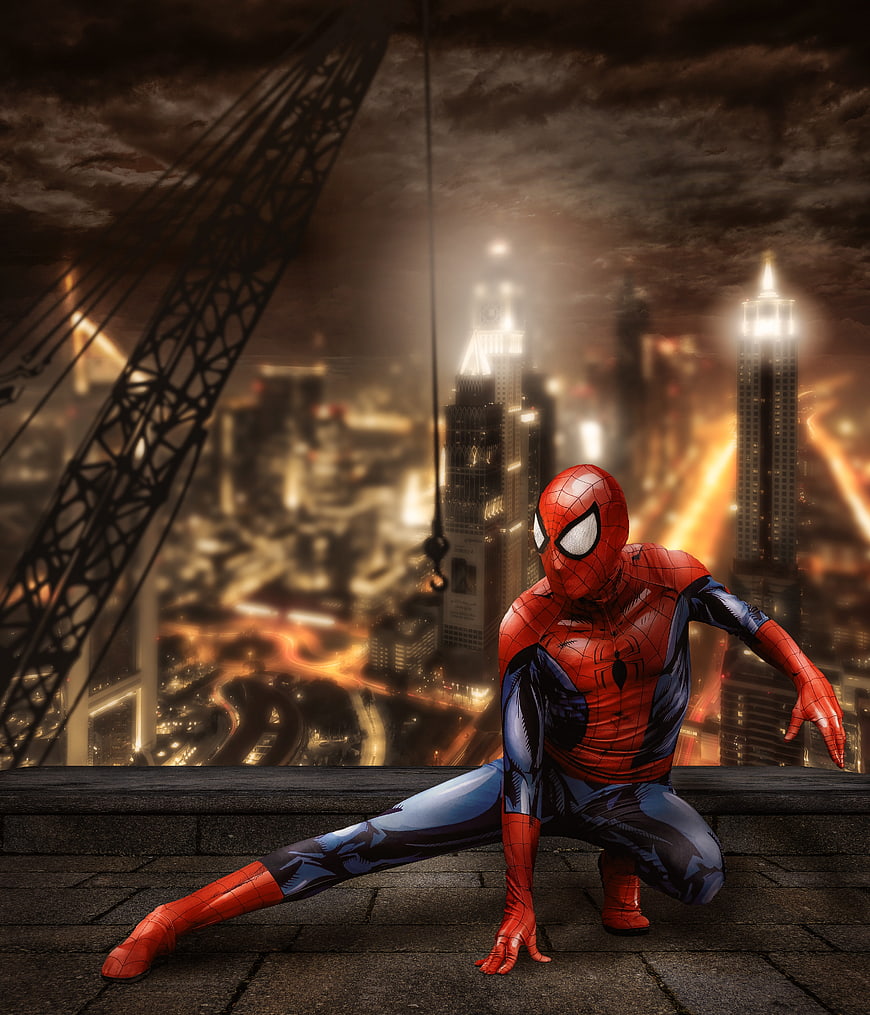 Spider-Man Crouching on Rooftop Against Dramatic Night City Skyline