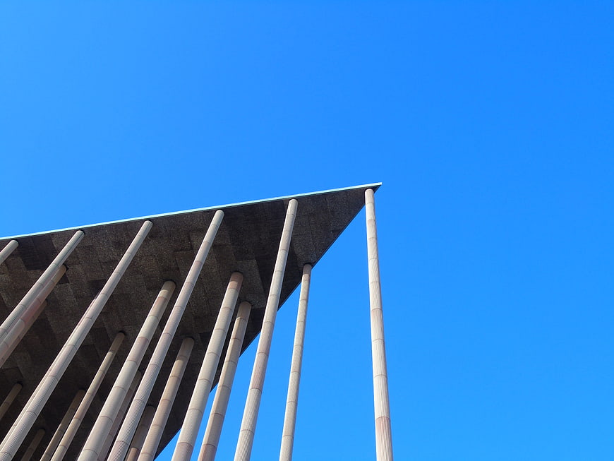 Modern architectural concrete columns against blue sky