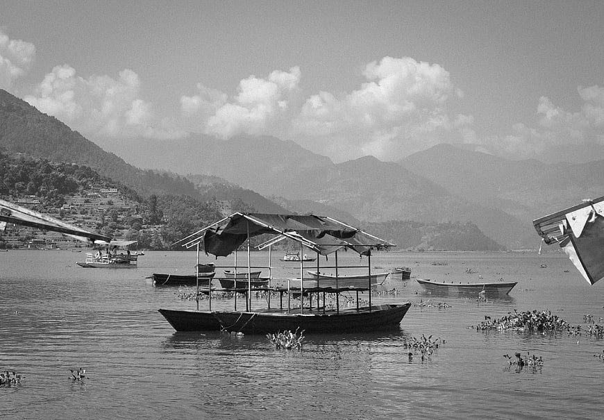 Black and white photo of boats on Fewa Lake, Pokhara, Nepal