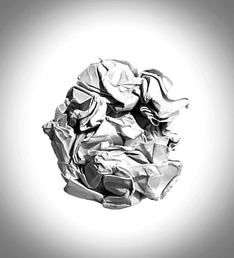 Crumpled white paper ball on gray gradient background