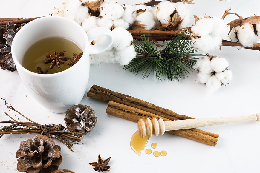 Winter Tea with Honey, Cinnamon, and Pine Cones Flat Lay