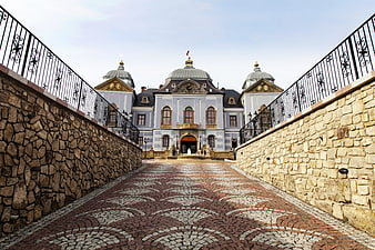 Lučenec Castle in Slovakia with ornate cobblestone bridge