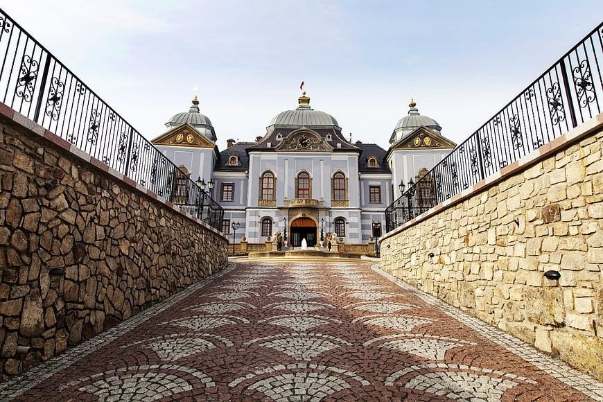 Lučenec Castle in Slovakia with ornate cobblestone bridge