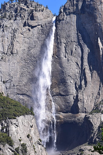 Majestic Yosemite Waterfall Cascading Down Granite Cliff