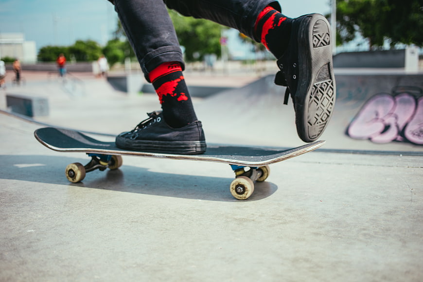 Closeup of Skateboarder Doing Trick at Skatepark