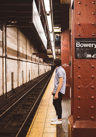 Man Waiting at Bowery Subway Station Platform
