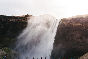 Majestic Skogafoss Waterfall in Iceland with Tourists