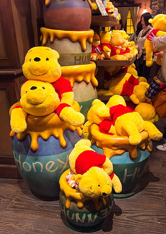 Winnie the Pooh Plush Toys in Honey Pots at Disney Gift Shop