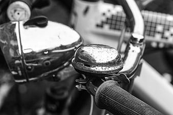 Close-up of vintage bicycle bell and handlebar grip
