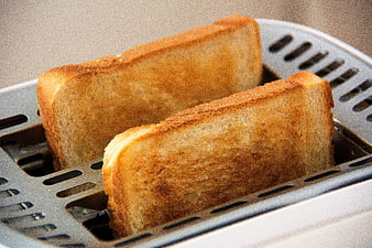 Golden Brown Toast Slices in a Toaster