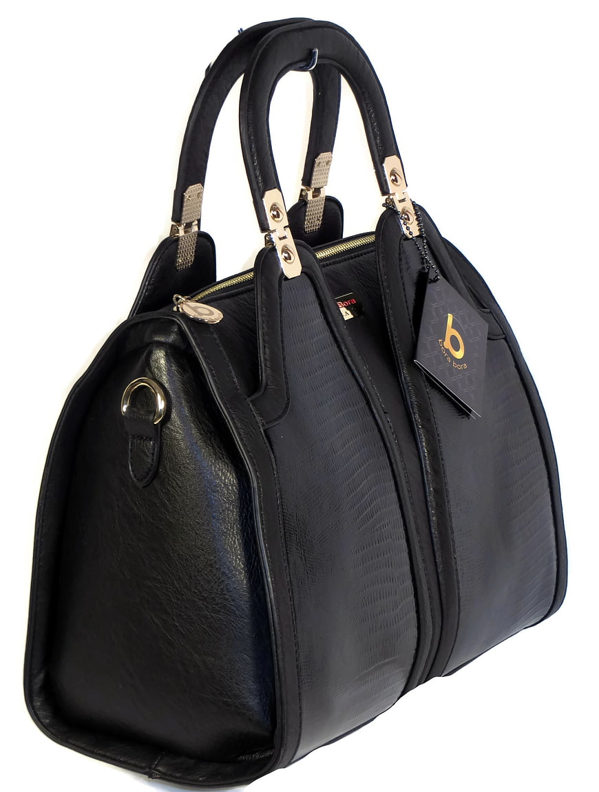 Black textured leather handbag with gold hardware and retail tag on white background