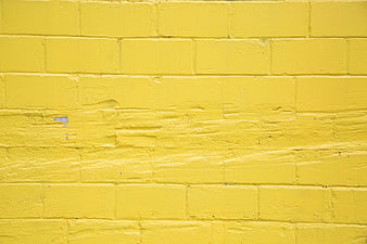Yellow Painted Brick Wall Texture Background