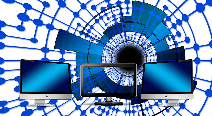 Three Computer Monitors with Digital Network Background
