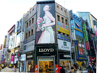 Busy Myeongdong Street Scene in Seoul with Large Billboards