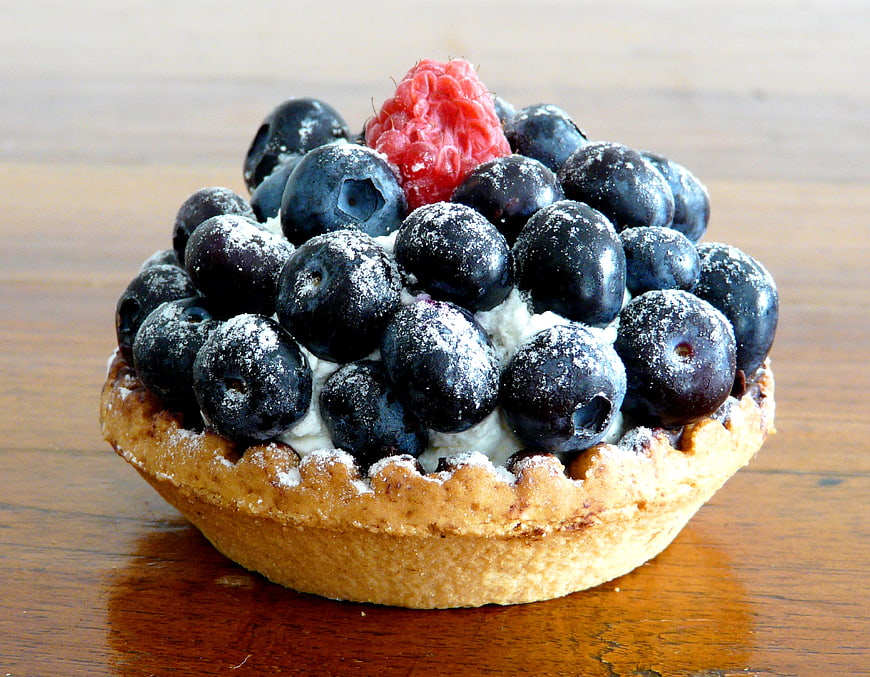 Fresh Blueberry and Raspberry Tart on Wooden Table