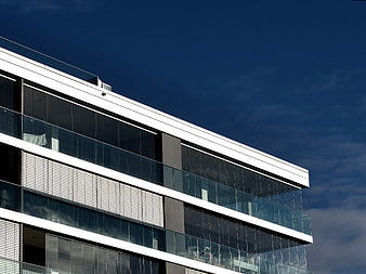 Modern Glass Building Architecture Against Blue Sky