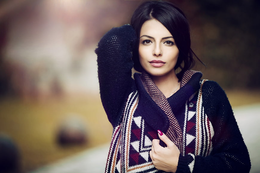 Portrait of Young Woman in Patterned Sweater and Scarf