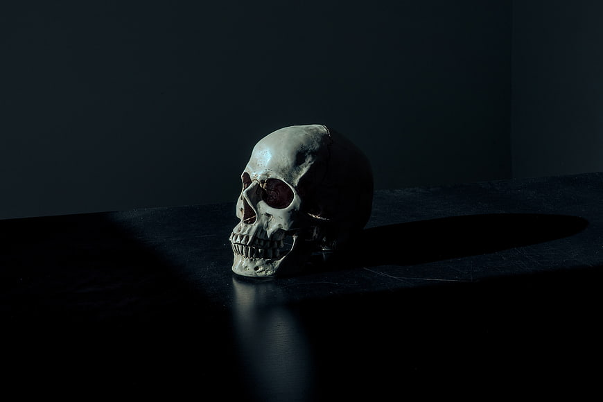 Dramatic Skull on Dark Table with Spotlight