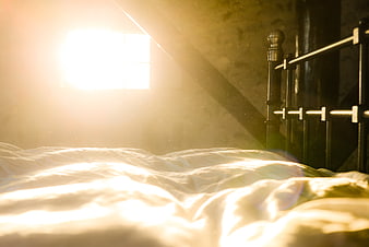 Sunlit Bedroom Interior with Morning Light and Dust Motes