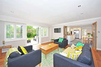 Bright Modern Living Room with Grey Sofas and Garden View