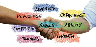Handshake with professional development keywords like skills and growth