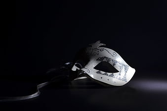 Elegant White Venetian Mask With Silver Details On Black Background