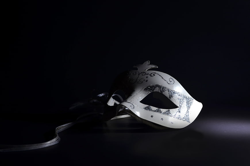 Elegant White Venetian Mask With Silver Details On Black Background