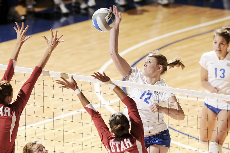 Women's Volleyball Match Action Shot at Net