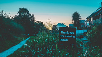Thank You For Slowing Down Sign By Canal At Dusk