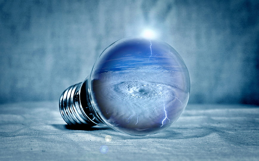 Lightbulb with Tornado and Lightning Inside Concept