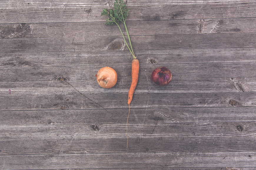 Fresh Carrot and Onions on Rustic Wooden Background