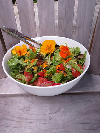 Fresh Garden Salad with Edible Flowers in White Bowl