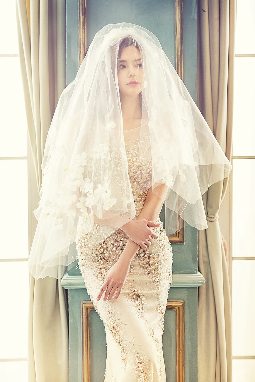 Elegant Asian Bride in Beaded Gown and Floral Veil