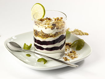 Layered Blueberry Yogurt Parfait with Granola and Lime Garnish