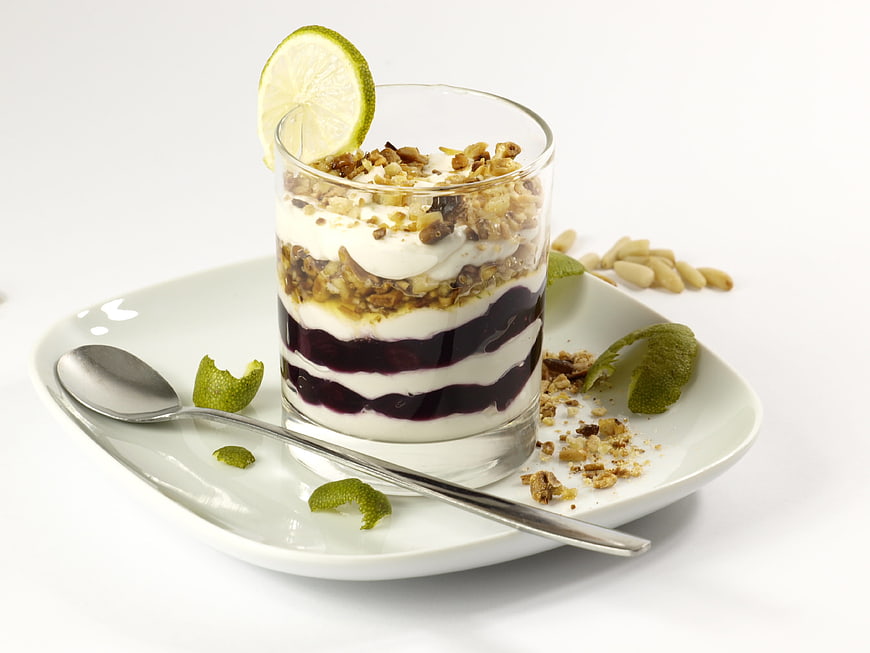 Layered Blueberry Yogurt Parfait with Granola and Lime Garnish