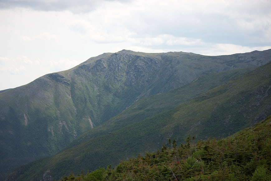 Green Mountain Ridge Under Cloudy Sky