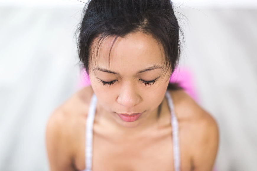 Close-up of woman with closed eyes looking down