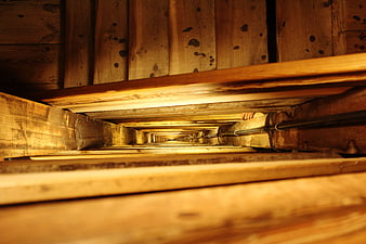 Perspective view of rustic wooden staircase interior